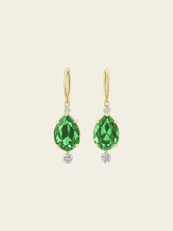 Gold earrings with green gemstones on a white background Hover Image