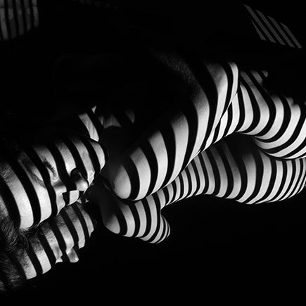Black and white striped pattern on a dark background